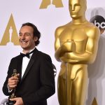 Alexandre Desplat poses in the press room with the award for best original score in a feature film for “The Grand Budapest Hotel” at the Oscars on Sunday, Feb. 22, 2015, at the Dolby Theatre in Los Angeles. (Photo by Jordan Strauss/Invision/AP)