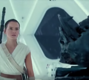 Rey looking at Vader's helmet