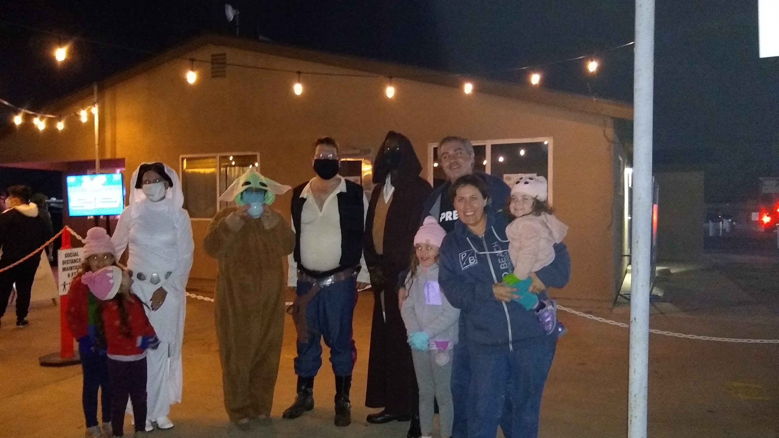 Cosplayers take a picture with my family. Return of the Jedi drive in.