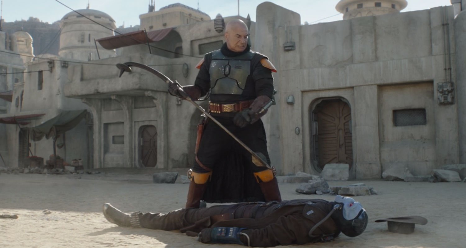 Boba fett standing over Cad Bane in The Book of Boba Fett