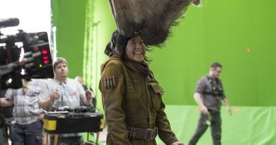 Kelly Marie Tran filming in front of a green screen