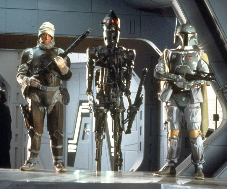 Dengar standing next to IG-88 and Boba Fett in The Empire Strikes Back