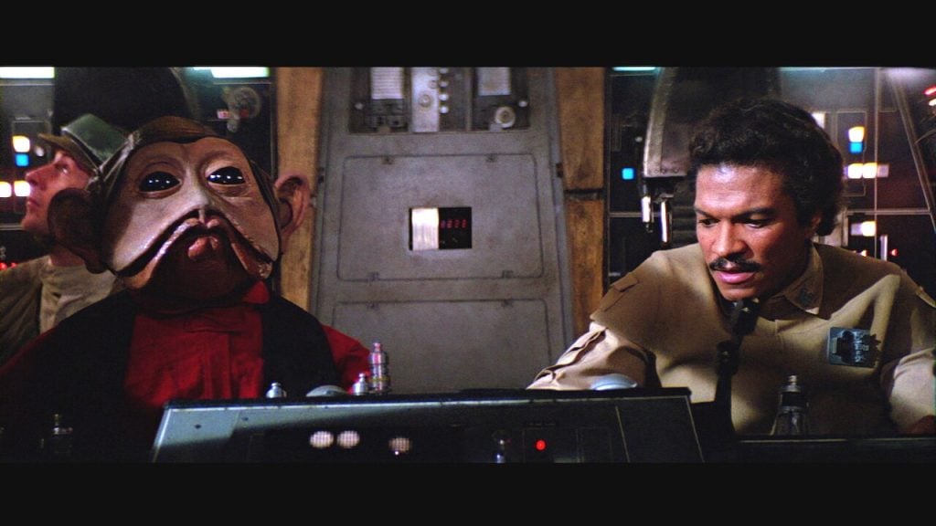 Nien Nunb flies the Millennium Falcon with Lando Calrissian